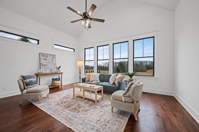 living room featuring high vaulted ceiling, wood finished floors, and a healthy amount of sunlight