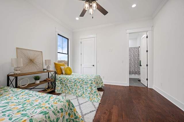 bedroom featuring crown molding, baseboards, and wood finished floors