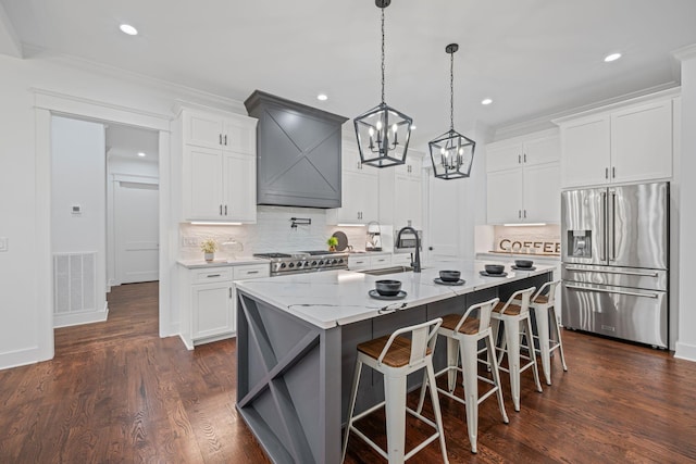 kitchen with a sink, visible vents, range, stainless steel fridge with ice dispenser, and custom range hood