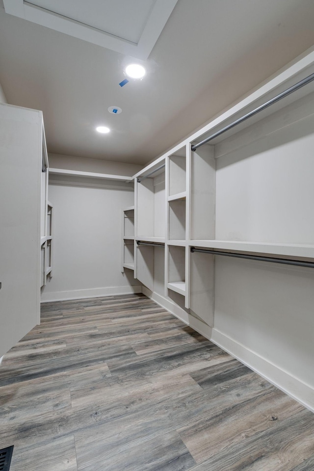 spacious closet with wood finished floors