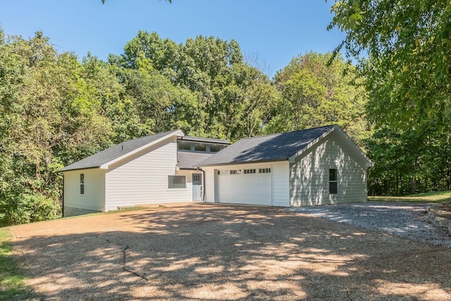 view of front facade featuring driveway and an attached garage