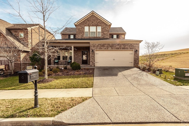 traditional-style house with driveway, covered porch, a front lawn, and brick siding