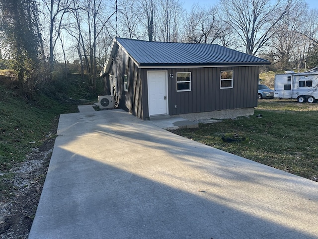 exterior space with ac unit and an outdoor structure