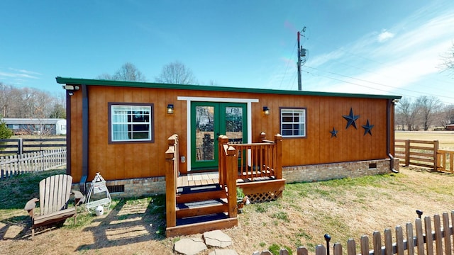 view of outbuilding with fence and an outdoor structure