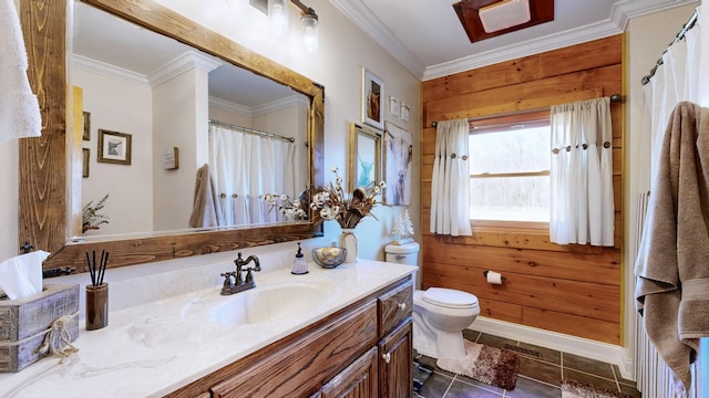 full bathroom with crown molding, vanity, toilet, and tile patterned floors