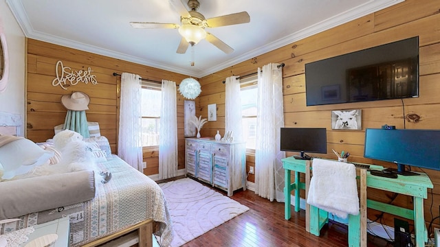 bedroom with hardwood / wood-style flooring and crown molding