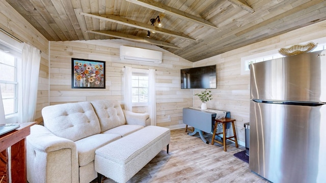 living area with light wood-type flooring, wood walls, a wall unit AC, and wood ceiling