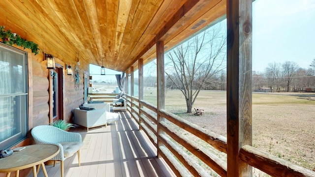 sunroom / solarium with wood ceiling and a wealth of natural light