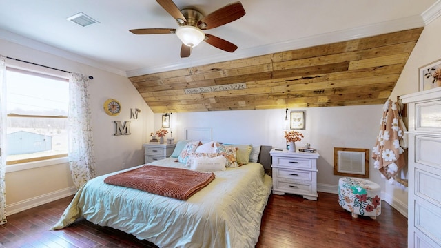 bedroom featuring lofted ceiling, wood-type flooring, visible vents, and baseboards