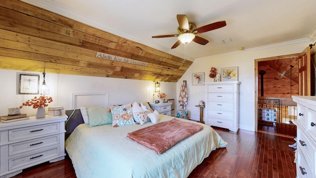 bedroom featuring crown molding, visible vents, dark wood-type flooring, vaulted ceiling, and baseboards