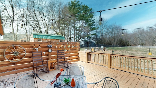 wooden terrace featuring fence