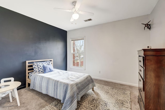 bedroom with baseboards, ceiling fan, visible vents, and light colored carpet