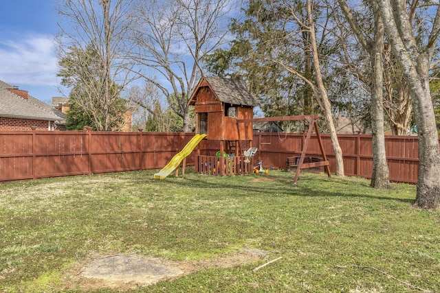 view of jungle gym featuring a fenced backyard and a lawn