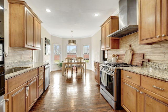 kitchen with stainless steel appliances, dark wood-type flooring, light stone counters, and wall chimney exhaust hood