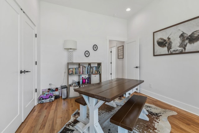 home office with light wood-type flooring, baseboards, and recessed lighting