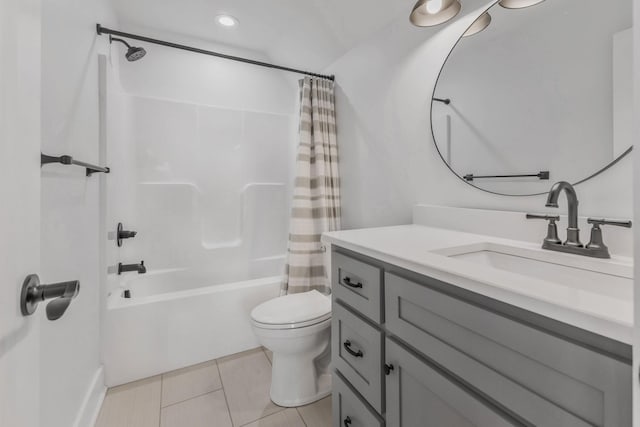 full bath with tile patterned floors, shower / bathtub combination with curtain, toilet, and vanity