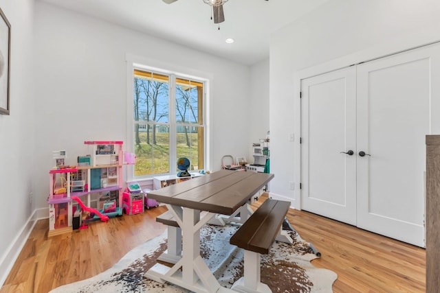 office area featuring light wood finished floors, baseboards, a ceiling fan, and recessed lighting