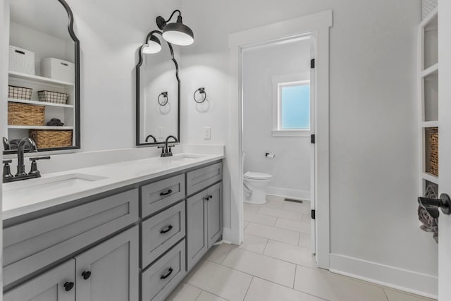 full bathroom featuring visible vents, a sink, toilet, and tile patterned floors