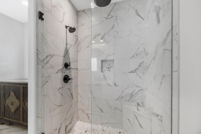 bathroom with a marble finish shower