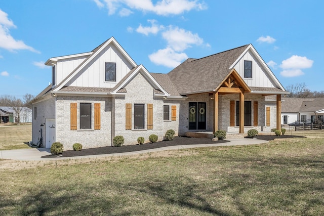 view of front of property featuring covered porch, brick siding, board and batten siding, and a front lawn