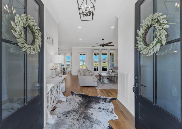 foyer featuring recessed lighting, ceiling fan, and wood finished floors