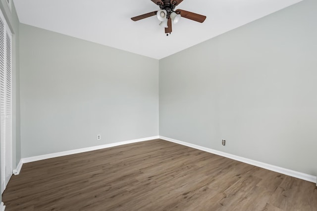 unfurnished room with ceiling fan, baseboards, and wood finished floors