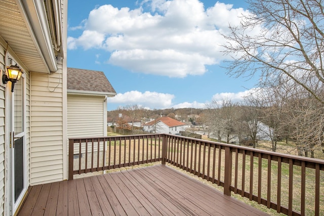 wooden terrace with a residential view