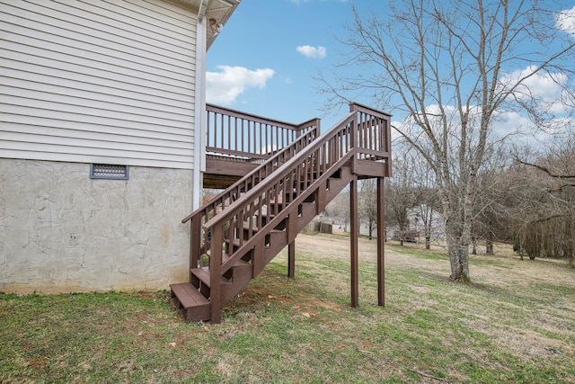 view of yard with a deck and stairway