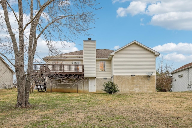 back of house featuring crawl space, a chimney, a deck, and a lawn