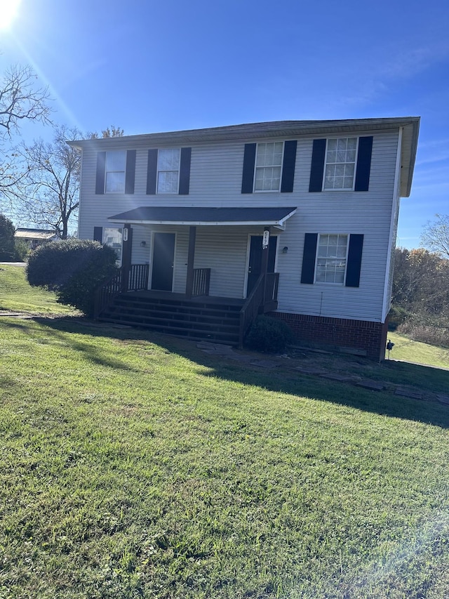 traditional-style house with a front lawn and a porch