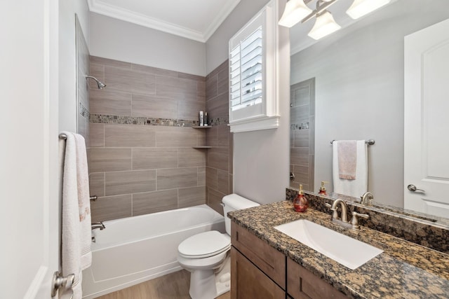 bathroom featuring crown molding, toilet, shower / bathing tub combination, wood finished floors, and vanity