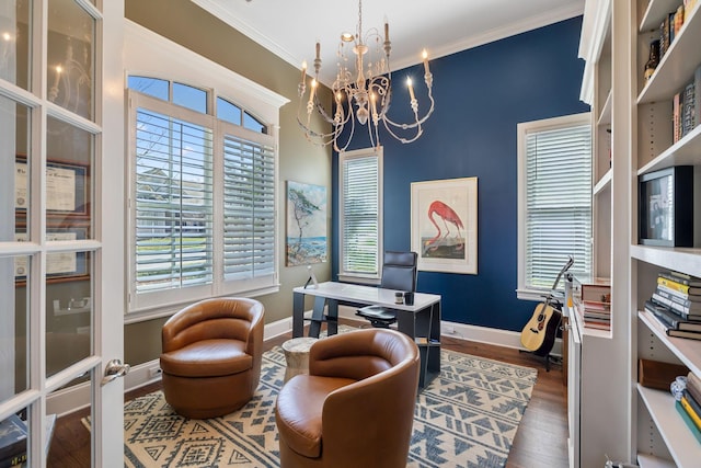 office area with dark wood-style floors, baseboards, crown molding, and an inviting chandelier