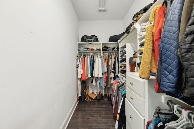 walk in closet featuring visible vents and wood finished floors