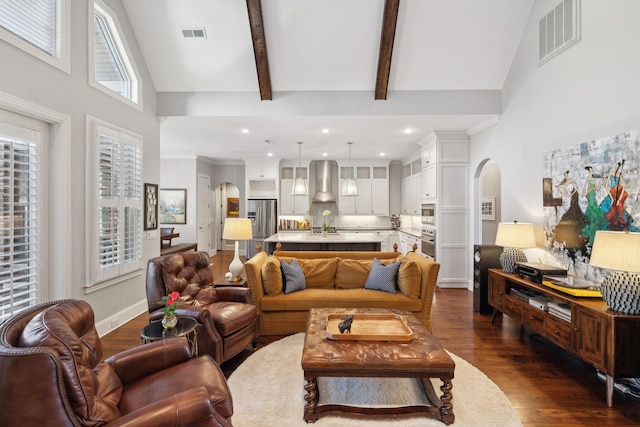 living room with visible vents, high vaulted ceiling, beam ceiling, arched walkways, and dark wood-type flooring