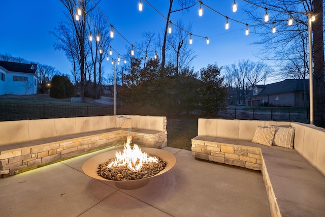 view of patio / terrace featuring fence and an outdoor fire pit