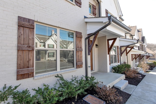 view of property exterior featuring brick siding