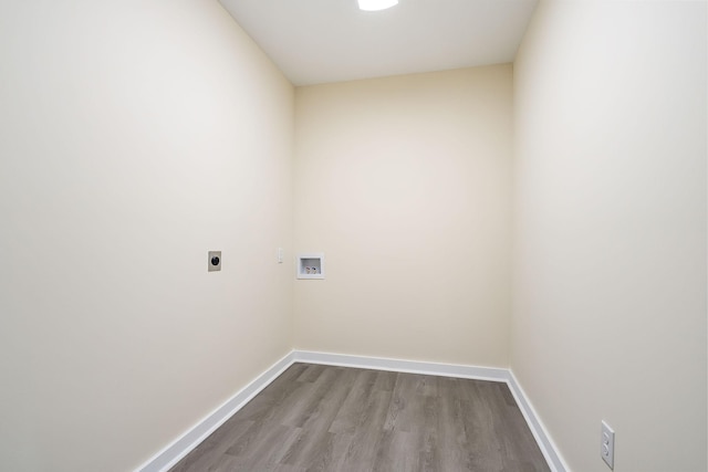 laundry area featuring baseboards, laundry area, hookup for a washing machine, wood finished floors, and electric dryer hookup