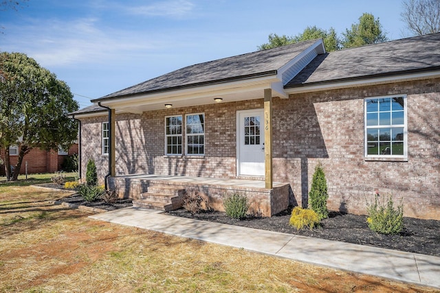 view of front of home with brick siding