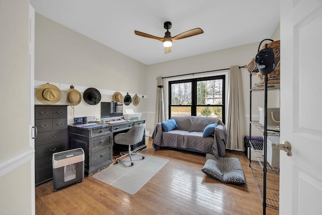 office area featuring radiator, light wood finished floors, and ceiling fan