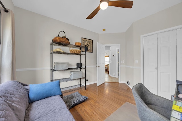 office featuring a ceiling fan, baseboards, and wood finished floors