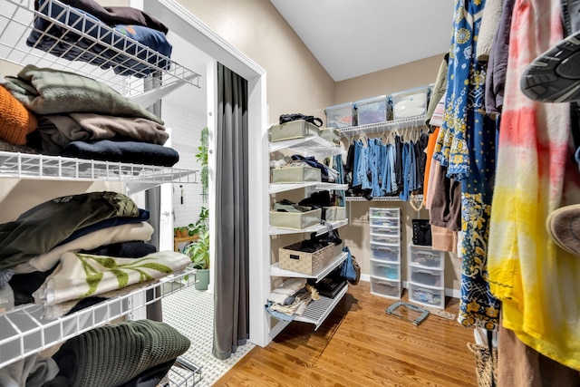 spacious closet with wood finished floors