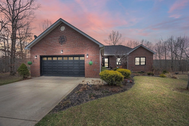 view of front facade featuring driveway, brick siding, a front lawn, and an attached garage