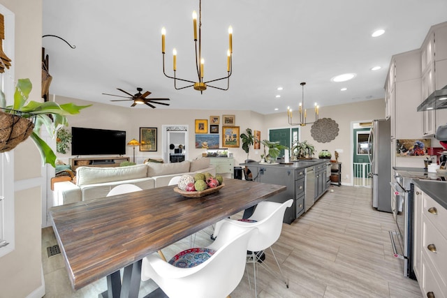 dining room featuring recessed lighting, visible vents, and ceiling fan with notable chandelier