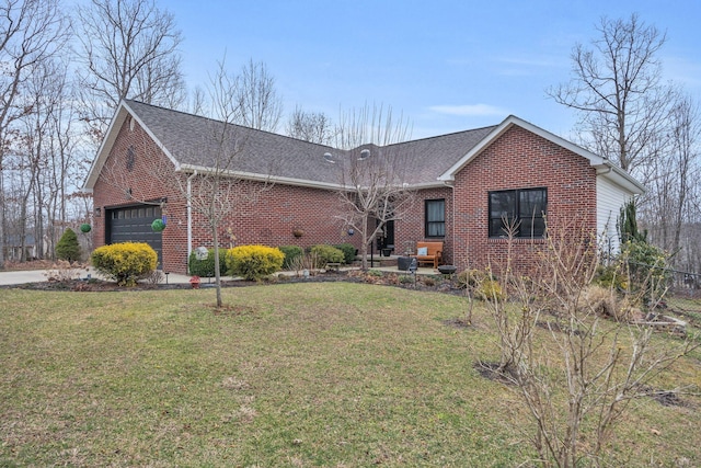 view of front of home featuring a garage, roof with shingles, a front lawn, and brick siding