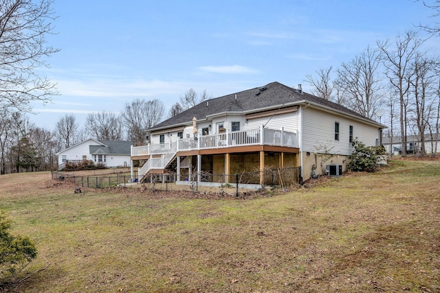 rear view of property featuring a yard, central air condition unit, fence, a wooden deck, and stairs