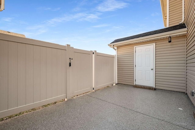 view of patio featuring fence