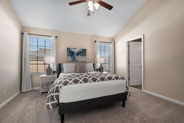 bedroom featuring carpet floors, multiple windows, baseboards, and lofted ceiling