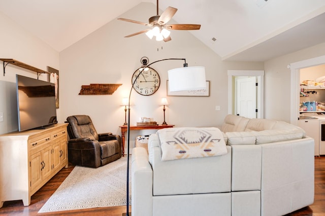 living room with ceiling fan, dark wood-style flooring, and vaulted ceiling