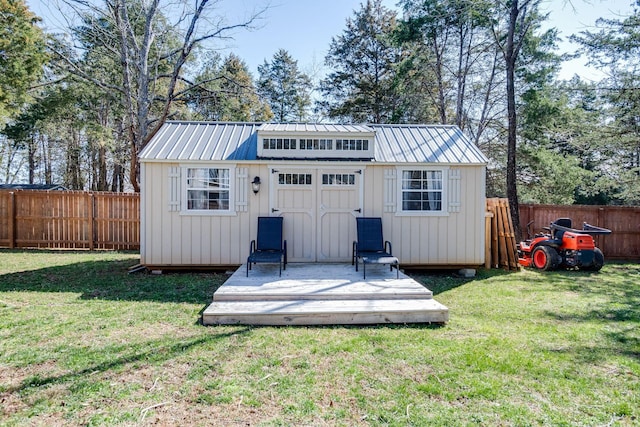 view of outbuilding featuring an outbuilding and a fenced backyard