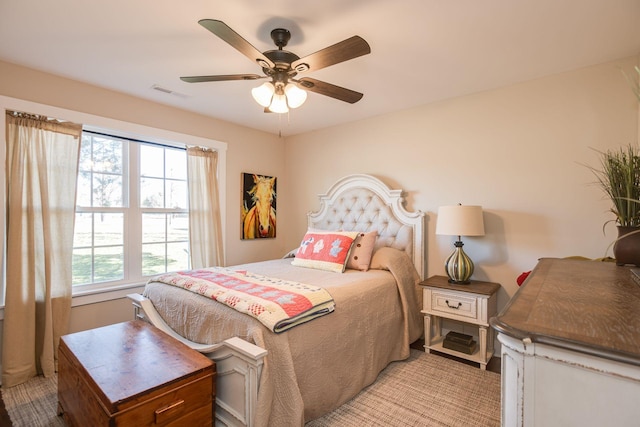 bedroom with visible vents and a ceiling fan